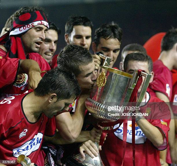 Mallorca players celebrate on the field with the cup after beating Recreativo Huelva 3-0 to win the King's Cup final at Martin Valero stadium of...