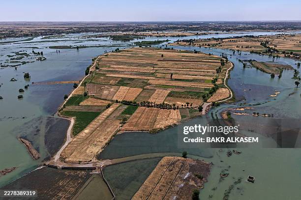 This aerial photograph shows an inundated area in Syria's Deir Ezzor province on May 31 following recent flooding as water levels from the Euphrates...