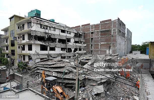 Team conducts rescue operations at the site of a five-storey building collapse on Westend Marg in Saidulajab, South Delhi, on May 31, 2026 in New...