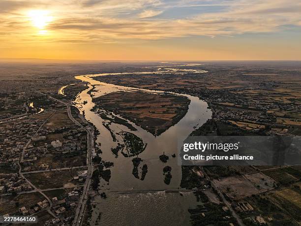 May 2026, Syria, Deir ez-Zur: An aerial view shows the rising water levels on the Euphrates River in Deir ez-Zur. Severe flooding caused by rising...