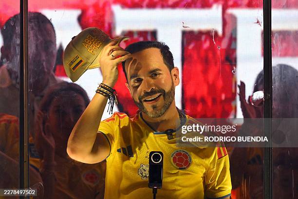 Colombia's presidential candidate Abelardo de la Espriella, of the Salvadores de la Patria movement, gestures as he speaks to supporters behind...