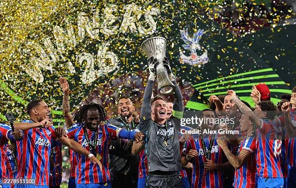 Dean Henderson of Crystal Palace lifts the UEFA Conference League trophy after his team's victory in the UEFA Conference League Final 2026 match...