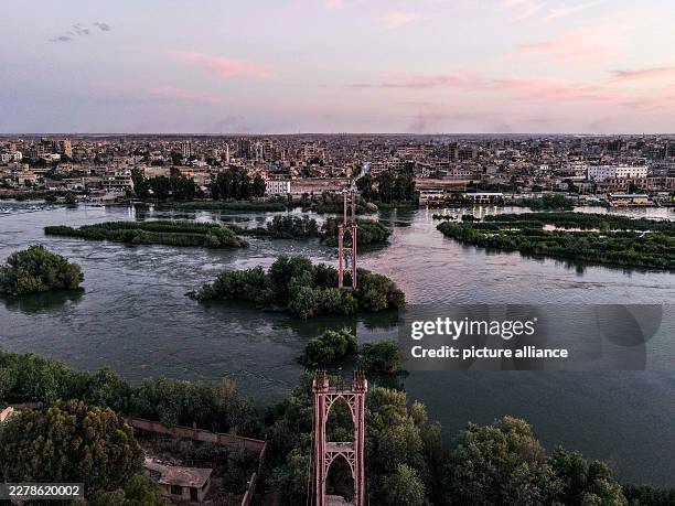 June 2026, Syria, Deir ez-Zur: An aerial view shows Deir ez-Zor's suspension bridge, which was built in 1927 and destroyed in 2013 during the Syrian...