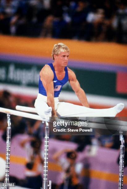 Bart Conner of the United States performs his routine in the Men's parallel bars competition on 4th August 1984 during the XXIII Olympic Summer Games...