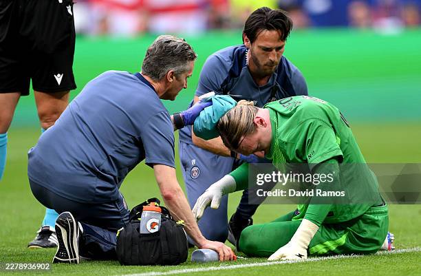 Matvey Safonov of Paris Saint-Germain receives medical treatment on the pitch during the UEFA Champions League Final 2026 match between Paris...