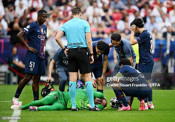 Matvey Safonov of Paris Saint-Germain receives medical treatment after going down injured during the UEFA Champions League Final 2026 match between...