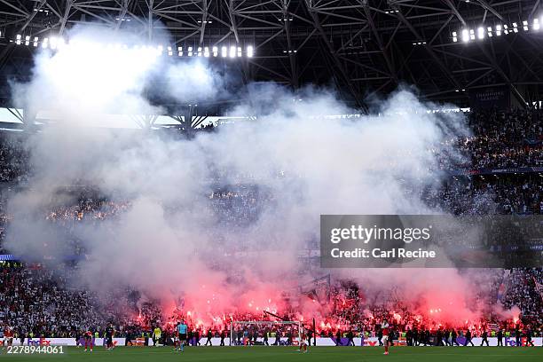 General view of the inside of the stadium as fans of Paris Saint-Germain use red smoke flares during the UEFA Champions League Final 2026 match...