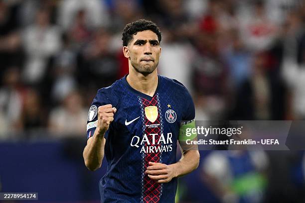 Achraf Hakimi of Paris Saint-Germain celebrates after he scores the team's fourth penalty in the penalty shoot out during the UEFA Champions League...
