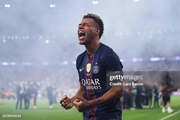 Desire Doue of Paris Saint-Germain celebrates after defeating Arsenal in the penalty shootout during the UEFA Champions League Final 2026 match...