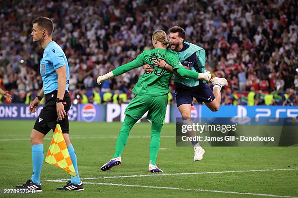 Khvicha Kvaratskhelia of Paris Saint-Germain and Matvey Safonov of Paris Saint-Germain celebrates following the team's victory in the penalty shoot...