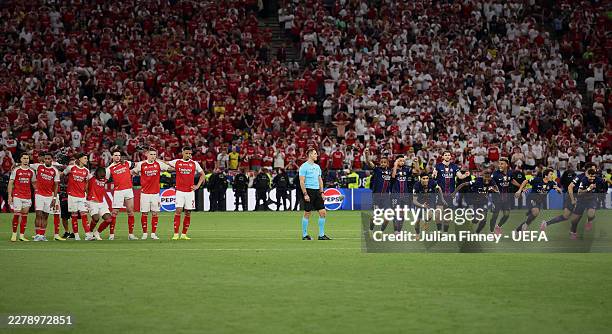 Arsenal look dejected as PSG win the penalty shoot out in the UEFA Champions League Final 2026 match between Paris Saint-Germain and Arsenal FC at...
