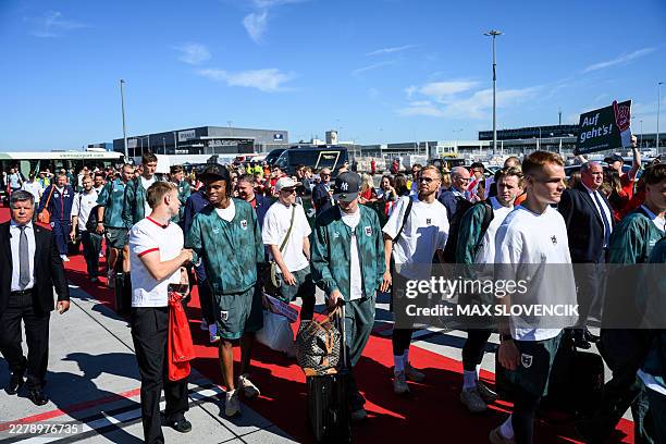 Members of Austria's national football team arrive to board a plane before departing from the Schwechat airport near Vienna, Austria, on June 4 ahead...