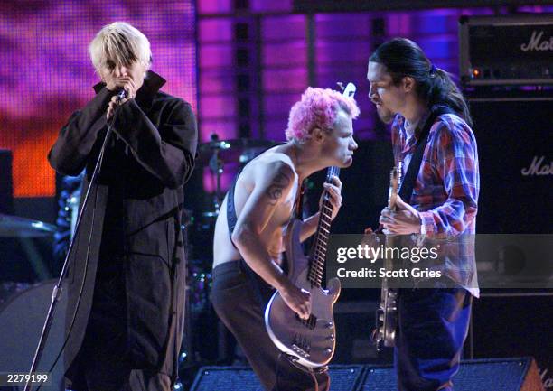 Red Hot Chili Peppers singer Anthony Kiedis , bassist Flea, and guitarist John Frusciante on the 1999 Billboard Music Awards at the MGM Grand Garden...