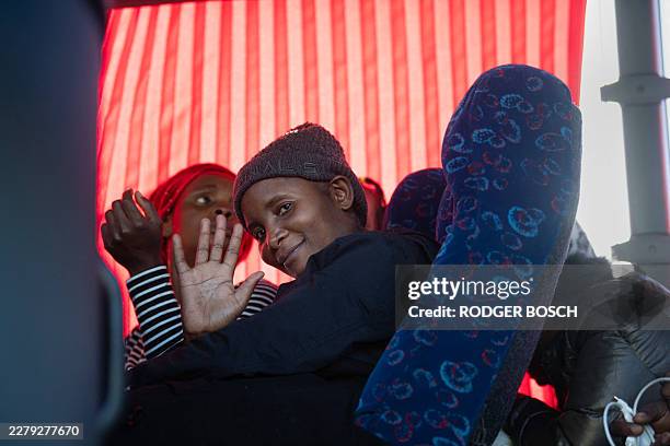 African migrants wait in a bus, joining hundreds of others as they are about to be voluntarily repatriated to their home countries, in Kleinmond...