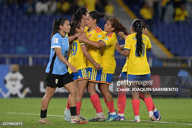 Colombia's midfielder Leicy Santos celebrates with her teammates after scoring a goal during the CONMEBOL Nations League Women football match between...