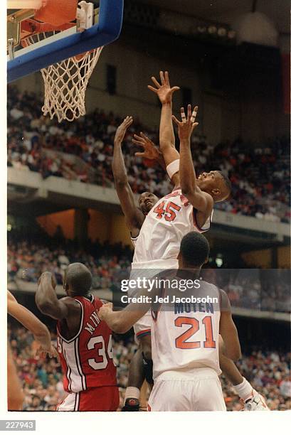 SYRACUSE ORANGEMEN CENTER OTIS HILL JUMPS UP HIGH FOR THE REBOUND DURING A BIG EAST CONFERENCE GAME WITH THE ST. JOHN''S REDMEN.