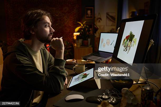 freelance illustrator working on digital art in dark home office - workbench table stock illustrations