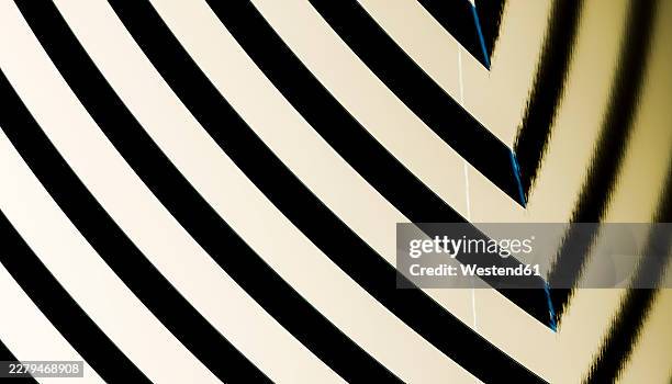abstract geometric background with black and gold stripes - black surface reflection stock illustrations