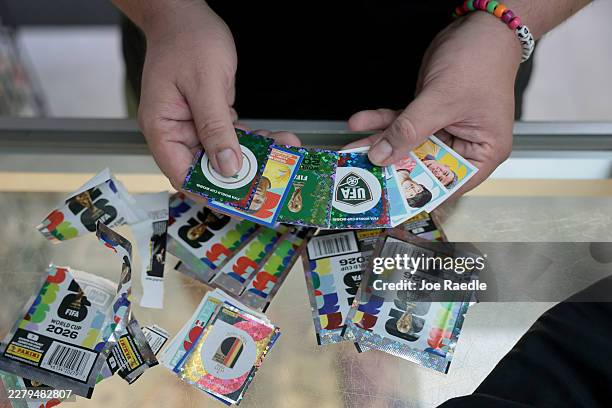 Kimber V. Shows off some of the FIFA World Cup 2026 Panini stickers he bought at the Soccer Locker on June 02, 2026 in Miami, Florida. Fans of World...