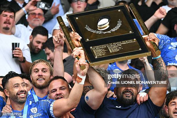 Vannes' players lift the shield at the end of the French Pro D2 rugby union final match between RC Vannes and Provence Rugby at the Ernest Wallon...