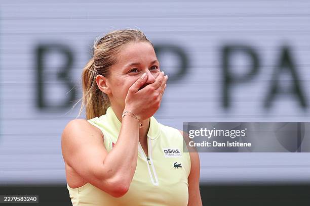 Maja Chwalinska of Poland reacts after winning match point against Anna Kalinskaya during their Women's Singles quarter-final match on Day Eleven of...