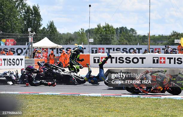 Riders collide after the start during the Hungarian Motorcycle MotoGP Grand Prix at the Balaton Park circuit in Balatonfokajar, Hungary, on June 7,...