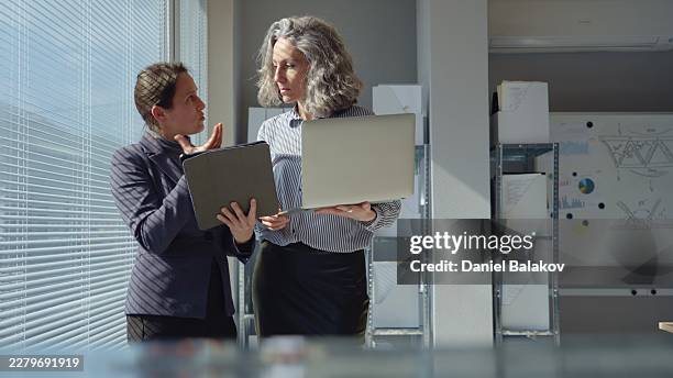 focused business teamwork & project collaboration of diverse generations - generation gap stock pictures, royalty-free photos & images