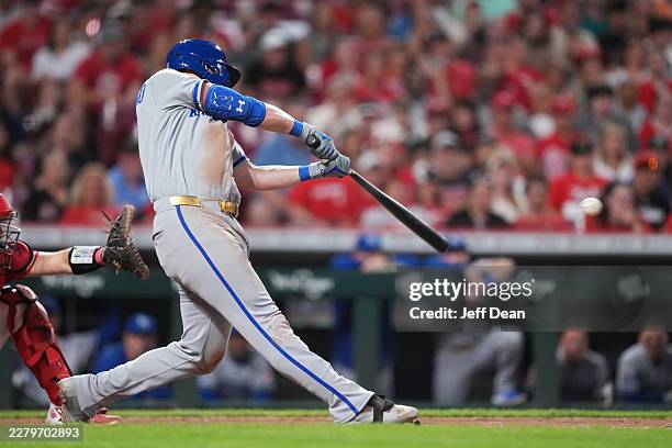 Vinnie Pasquantino of the Kansas City Royals hits a single during the eighth inning of a baseball game against the Cincinnati Reds at Great American...