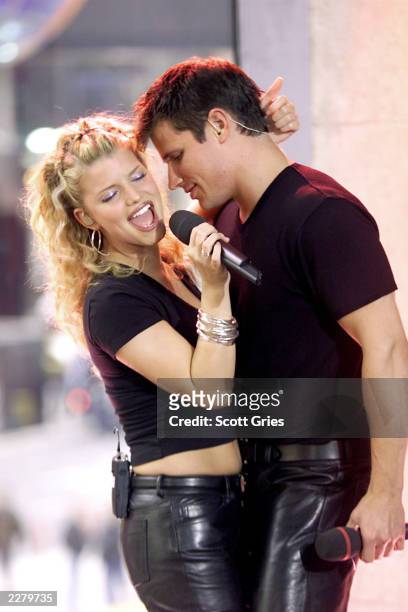 Jessica Simpson and Nick Lachey of 98 Degrees performing their hit song 'Where You Are' during TRL at the MTV studios in New York.