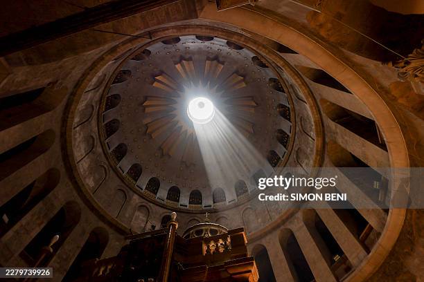 Sunlight shines through the dome of the Church of the Holy Sepulchre in Jerusalem, Israel, on June 7, 2026. The Church of the Holy Sepulchre, located...