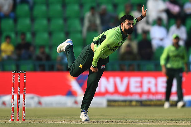 Shadab Khan of Pakistan bowls during game three of the One Day International series between Pakistan and Australia at Gaddafi Stadium on June 04,...