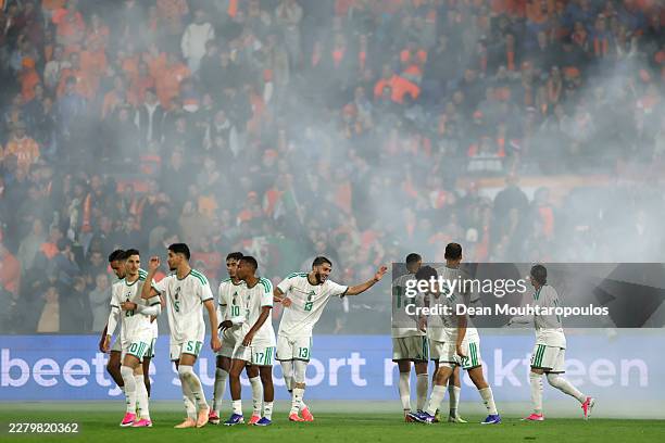 Anis Hadj Moussa of Algeria celebrates scoring his team's first goal with teammates during the international friendly match between Netherlands and...