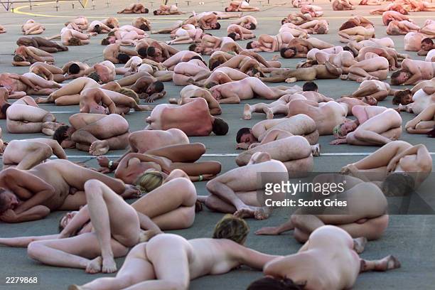 An estimated 100 people posed nude for controversial artist/photographer Spencer Tunick at Woodstock 99 in Rome, New York. The Woodstock 99 festival...