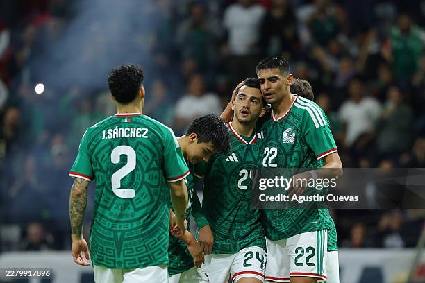 Luis Chávez of Mexico celebrates with teammates after scoring the team's fifth goal during the international friendly match between Mexico and Serbia...
