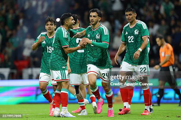 Luis Chávez of Mexico celebrates with teammates after scoring the team's fifth goal during the international friendly match between Mexico and Serbia...