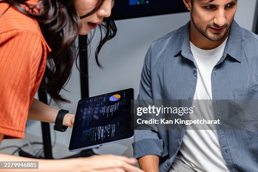 Software Team Discussing Development Roadmap, Data Analysis, and AI Coding Workflow, Collaboration work together in tech office. Software Team Discussing Development Roadmap, Data Analysis, and AI Coding Workflow, Collaboration work together in tech office.
