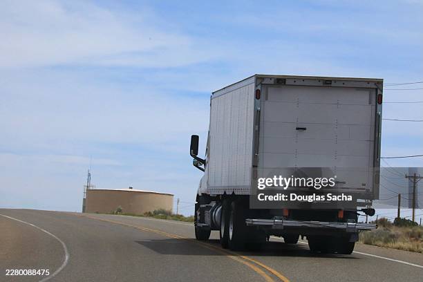 delivery truck climbing the steep road - diesel trucks stock pictures, royalty-free photos & images