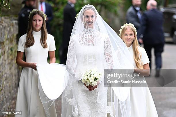 Harriet Sperling arrives for her Royal wedding to Peter Phillips followed by her bridesmaids Georgina Sperling and Isla Phillips at All Saints Church...