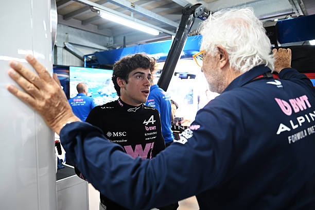 Franco Colapinto of Argentina and Alpine F1 and Flavio Briatore, Executive Advisor of Alpine F1 talk in the garage during qualifying ahead of the F1...