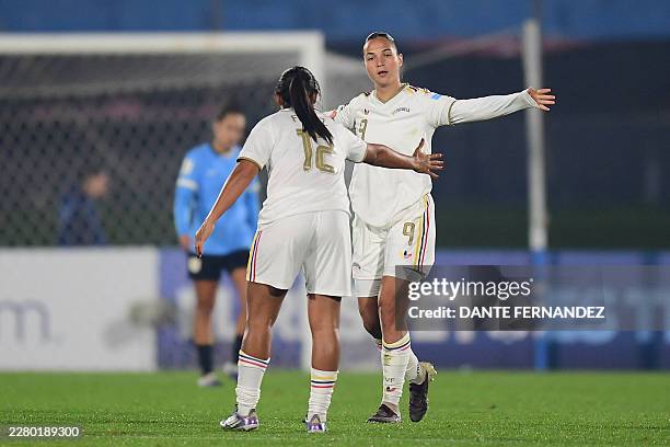 Venezuela's forward Deyna Castellanos celebrates with her teammate Venezuela's forward Genesis Florez after scoring the equalising goal during the...