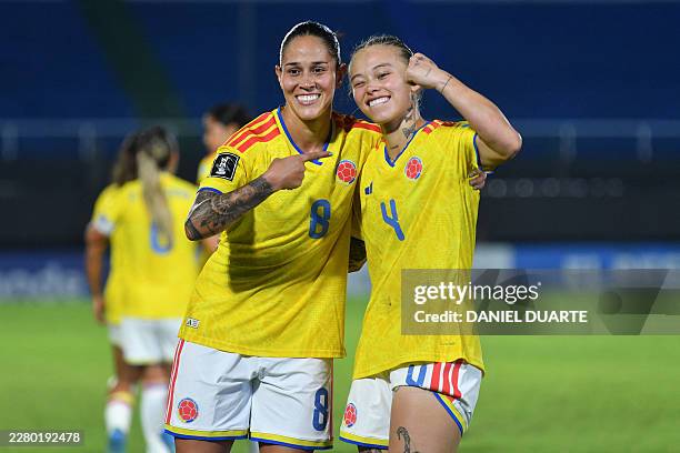 Colombia's defender Ana Guzman celebrates with her teammate Colombia's midfielder Marcela Restrepo after scoring her team's fourth goal during the...