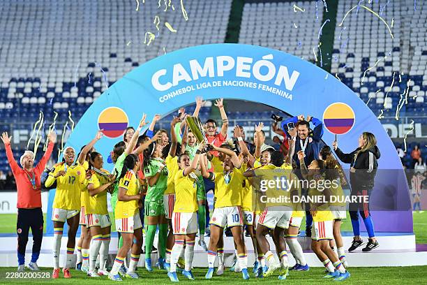 Colombia's midfielder Daniela Montoya and Colombia's midfielder Leicy Santos lift the trophy after Colombia won the CONMEBOL Nations League Women...
