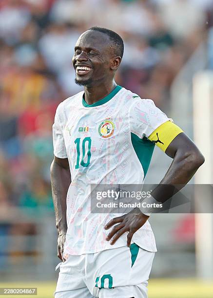 Sadio Mane of Senegal laughs after he heard a comment from fans in the second half of the international friendly match between Saudi Arabia and...