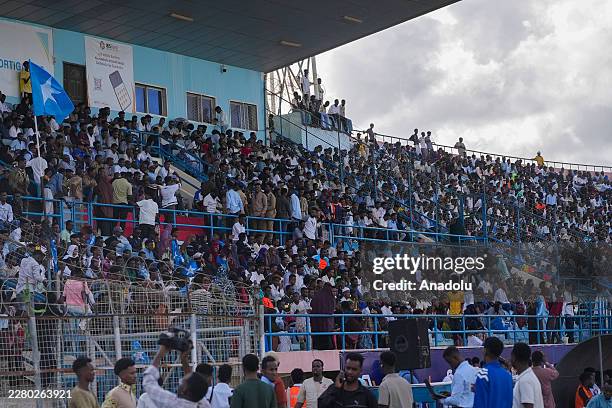 Somali referee Omar Abdulkadir Artan greets fans who show support for him, after he was denied entry into the United States where he had traveled to...