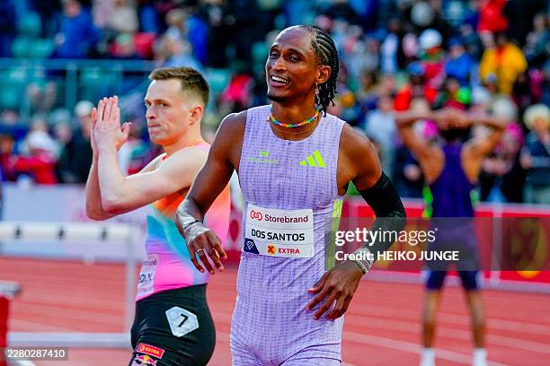 Brazil's Alison Dos Santos wins ahead of Norway's Karsten Warholm in the Men's 400m Hurdles event of the Olso Diamond League athletics meeting in...