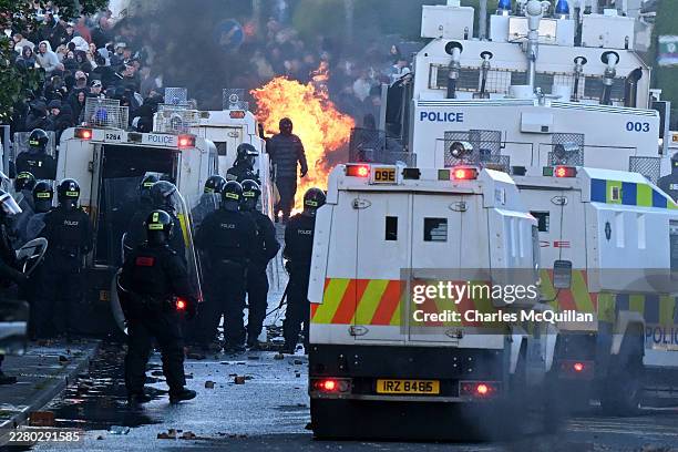 Police stand guard as protests take place near the Chimney Corner Hotel, which allegedly may be a hotel housing migrants, following a night of...