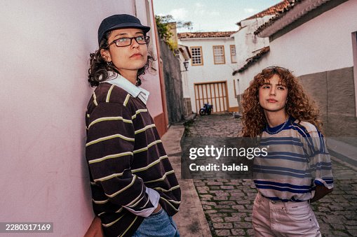 Generation Z Friends Standing Outdoors in Nostalgic Film Style Generation Z Friends Standing Outdoors in Nostalgic Film Style