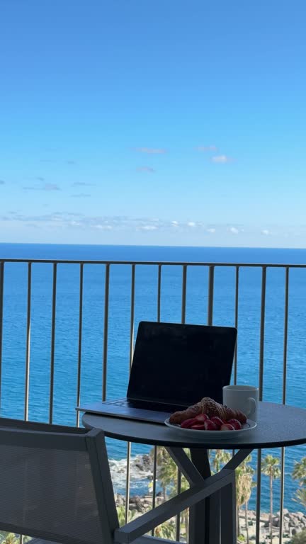 https://media.gettyimages.com/id/2280353841/video/remote-work-setup-with-ocean-view-balcony.jpg?b=1&s=640x640&k=20&c=eDAt_mlbNnS_DmZRYftxfiU4HOwQ92ZP7ApfZL1LVyQ=
