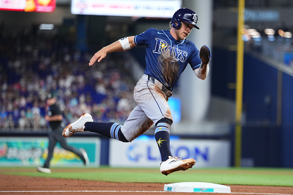 Miami Rays Taylor Walls of the Tampa Bay Rays rounds third base on his way home ...