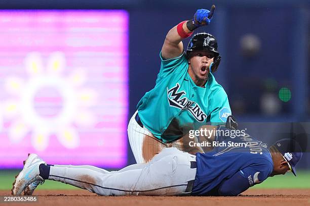 Heriberto Hernández of the Miami Marlins reacts after being tagged out by Richie Palacios of the Tampa Bay Rays during the fifth inning at loanDepot...